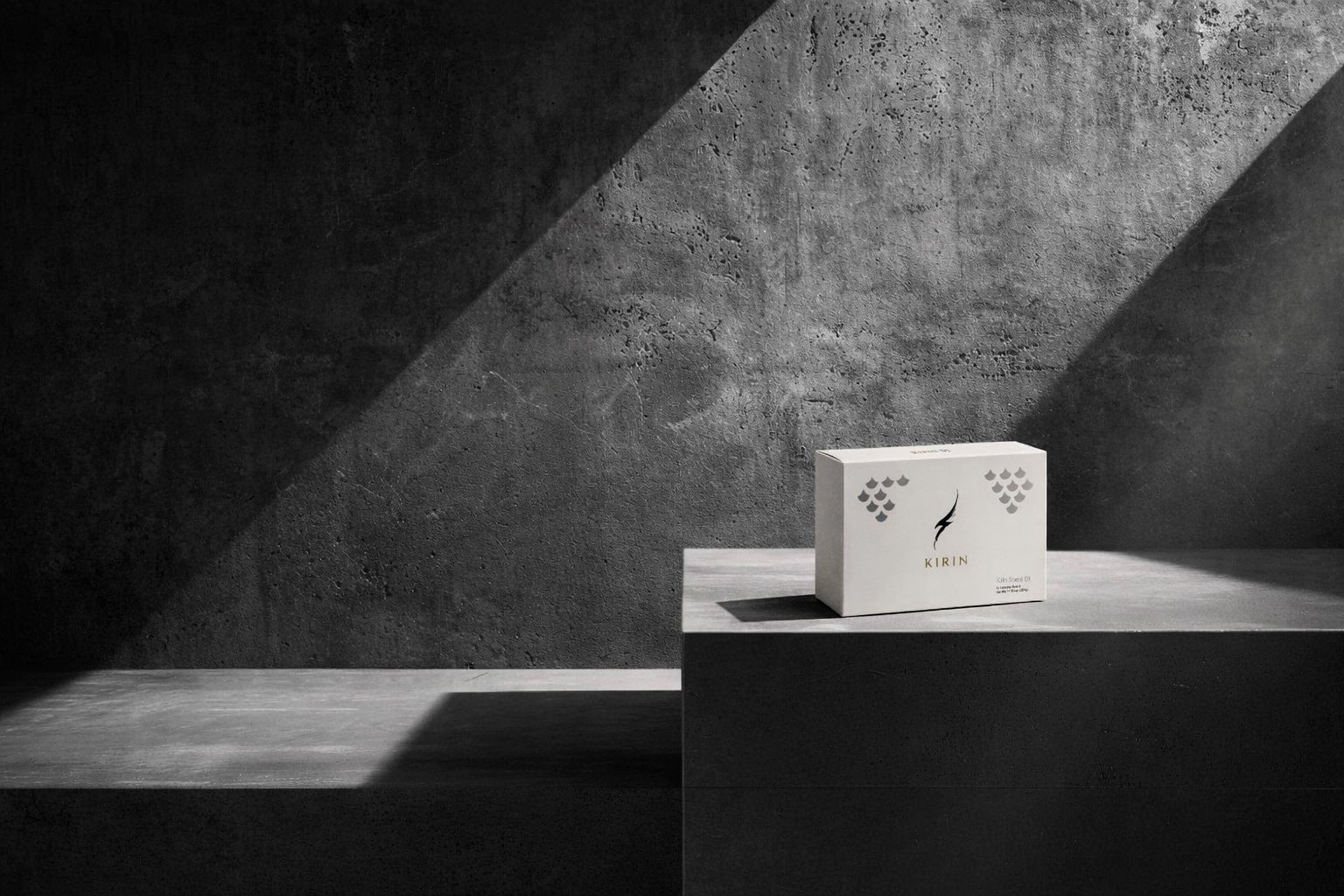 Kirin Scent 01 - Premium architectural car fragrance diffuser on a concrete pedestal. Minimalist luxury automotive scent for modern vehicle interiors.